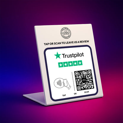 a sign with instructions for leaving a review on a Trustpilot platform. The sign includes a QR code and a star rating symbol, indicating that the review is five stars. The sign also provides instructions for either "Tapping" or " Scanning" to leave a review, suggesting that the user can either physically tap or scan the sign to leave feedback.