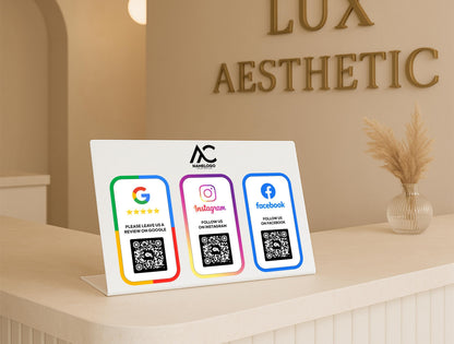 Detailed view of two QR codes printed on acrylic sign – supports customer access to digital links via scan or tap-to-pay