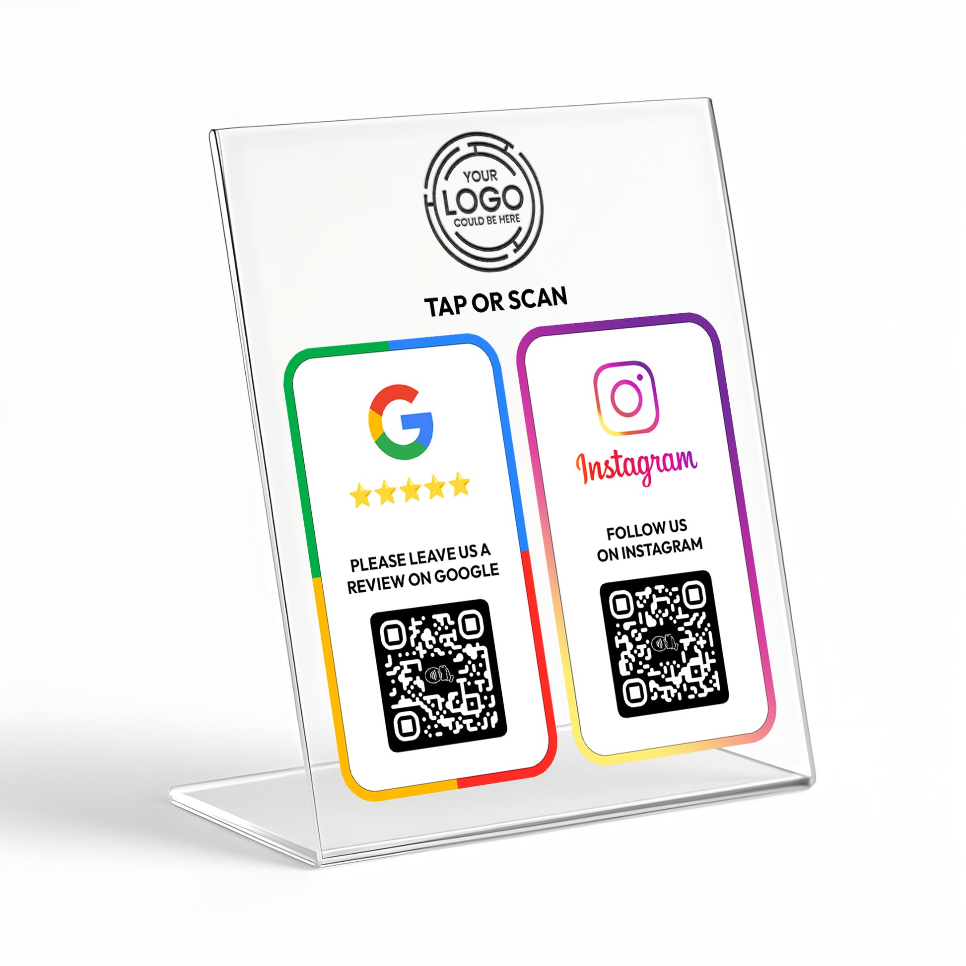 a clear plastic stand with a QR code and instructions for using the stand. The QR code is accompanied by two social media platforms: Google and Instagram. The stand also has a logo and text that reads "TAP OR SCAN" and "PLEASE LEAVE US A REVIEW ON GOOGLE".