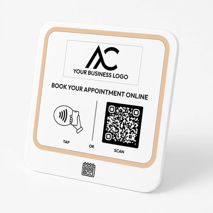 The image is a sign with instructions for booking appointments online. It includes a QR code and a button for either tapping or scanning.