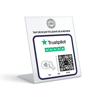 a sign with instructions for leaving a review on a platform called Trustpilot. The sign includes a QR code and a star symbol, indicating that the review is being left by a user with a rating of 5 stars. The sign also provides options for "TAP" or "SCAN" to leave a review, and the platform is described as a "TRUSTPILOT" with a rating of 5 stars.