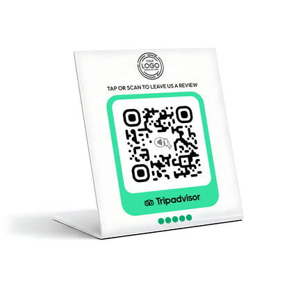 a QR code on a white stand, with the text "TAP OR SCAN TO LEAVE US A REVIEW" and "Tripadvisor" printed on it.