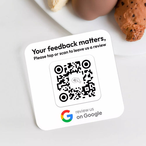 a QR code on a white surface, with a message asking for feedback and a Google logo at the bottom.