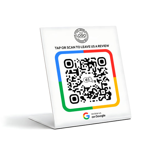 a QR code on a stand, which is a type of digital payment method. The QR code is accompanied by a message that reads "TAP OR SCAN TO LEAVE US A REVIEW" and a logo for Google.